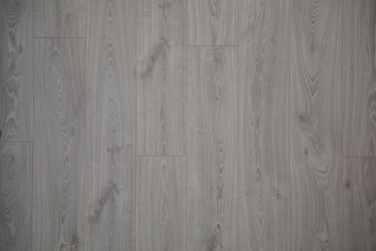 Close-up view of gray wooden floor planks with natural texture and pattern.